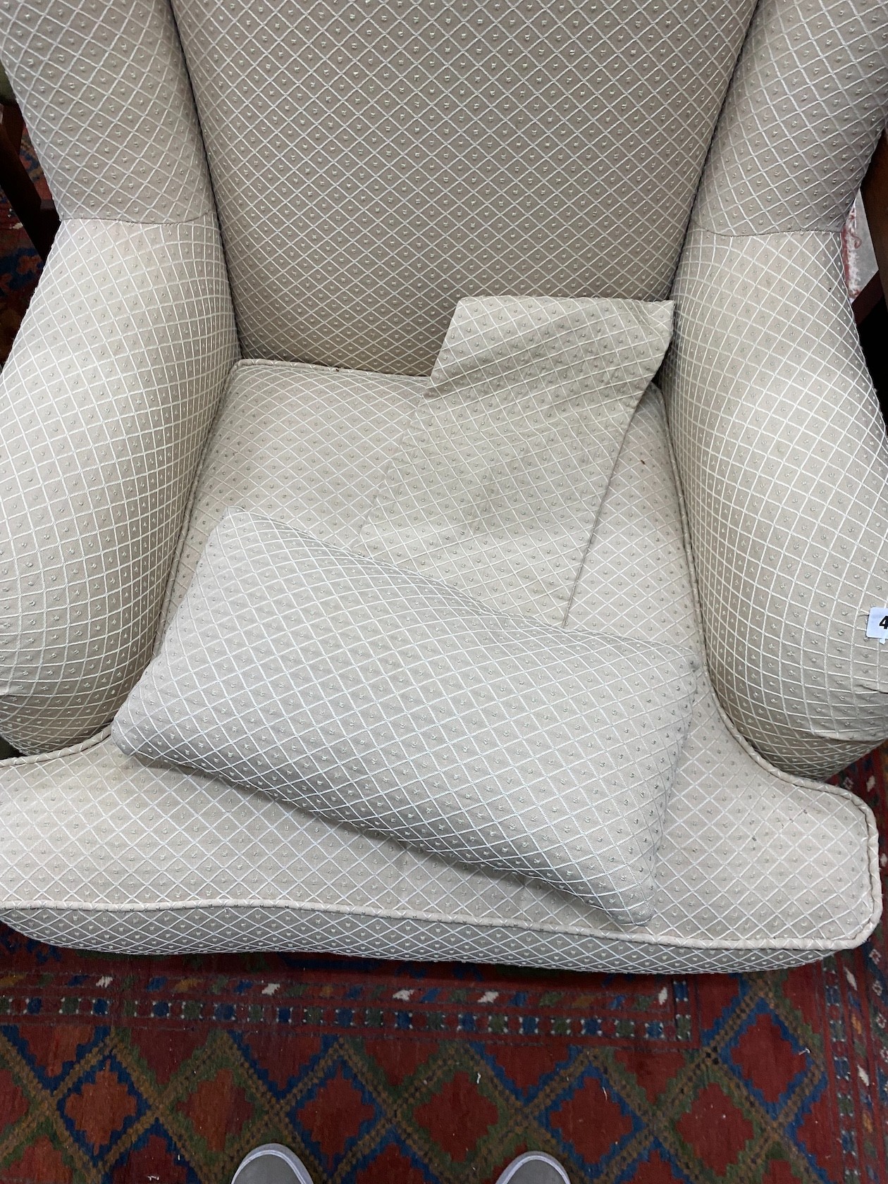 A modern Wesley-Barrell upholstered armchair